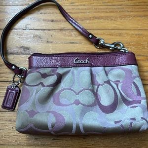 Purple coach wristlet with silver hardware